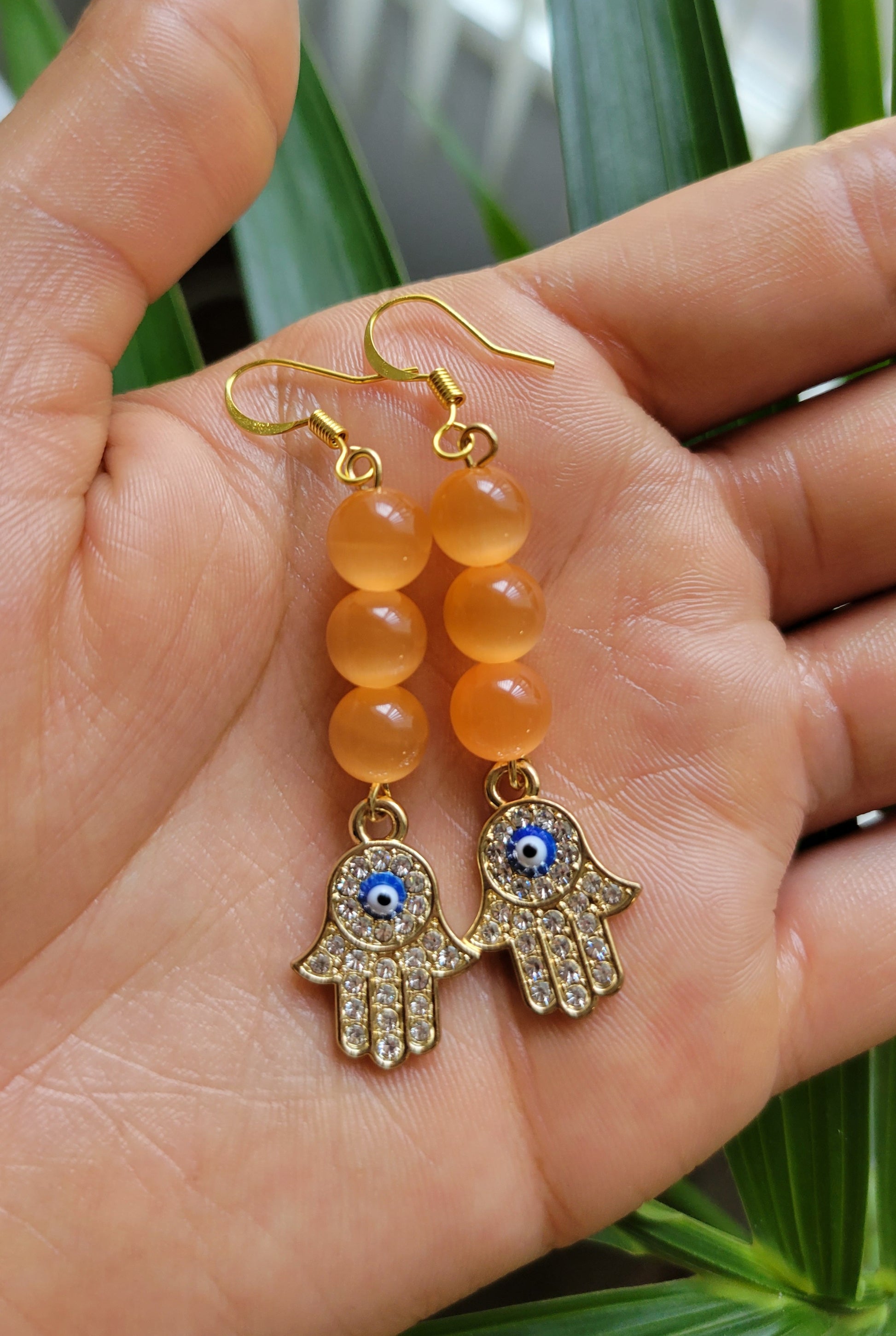 Orange hamsa hand earrings