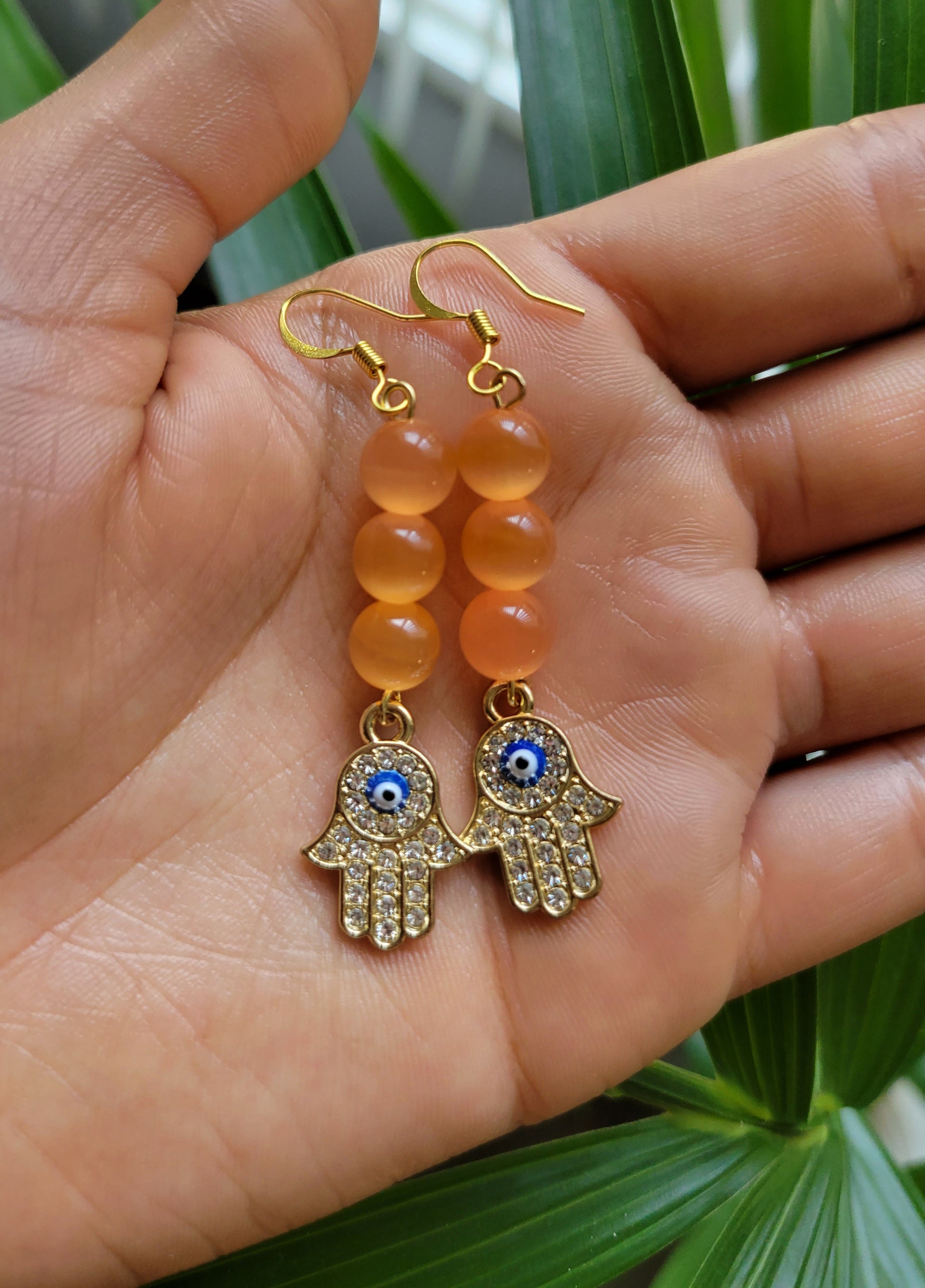 Orange hamsa hand earrings